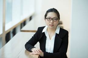 A person in a suit leaning on a table

AI-generated content may be incorrect.